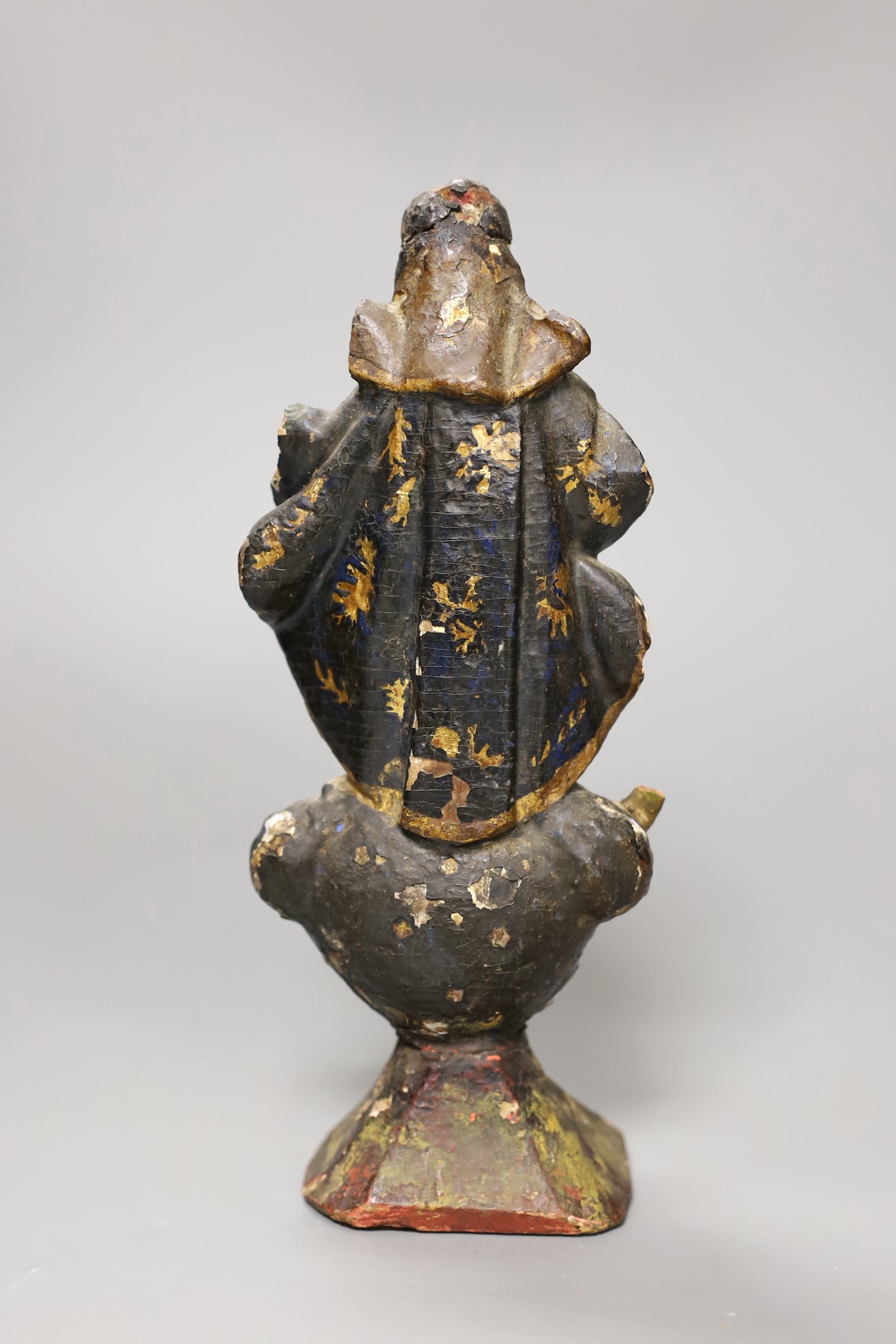 A 17th century Jesuit carved figure of a saint, 23cm